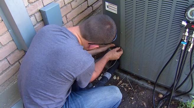 David servicing an air conditioner compressor